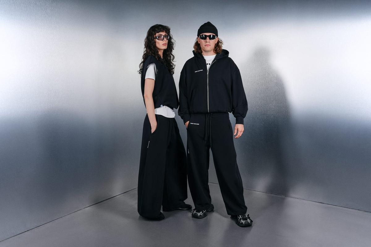All-black KYN looks: vest, hoodie, wide trousers