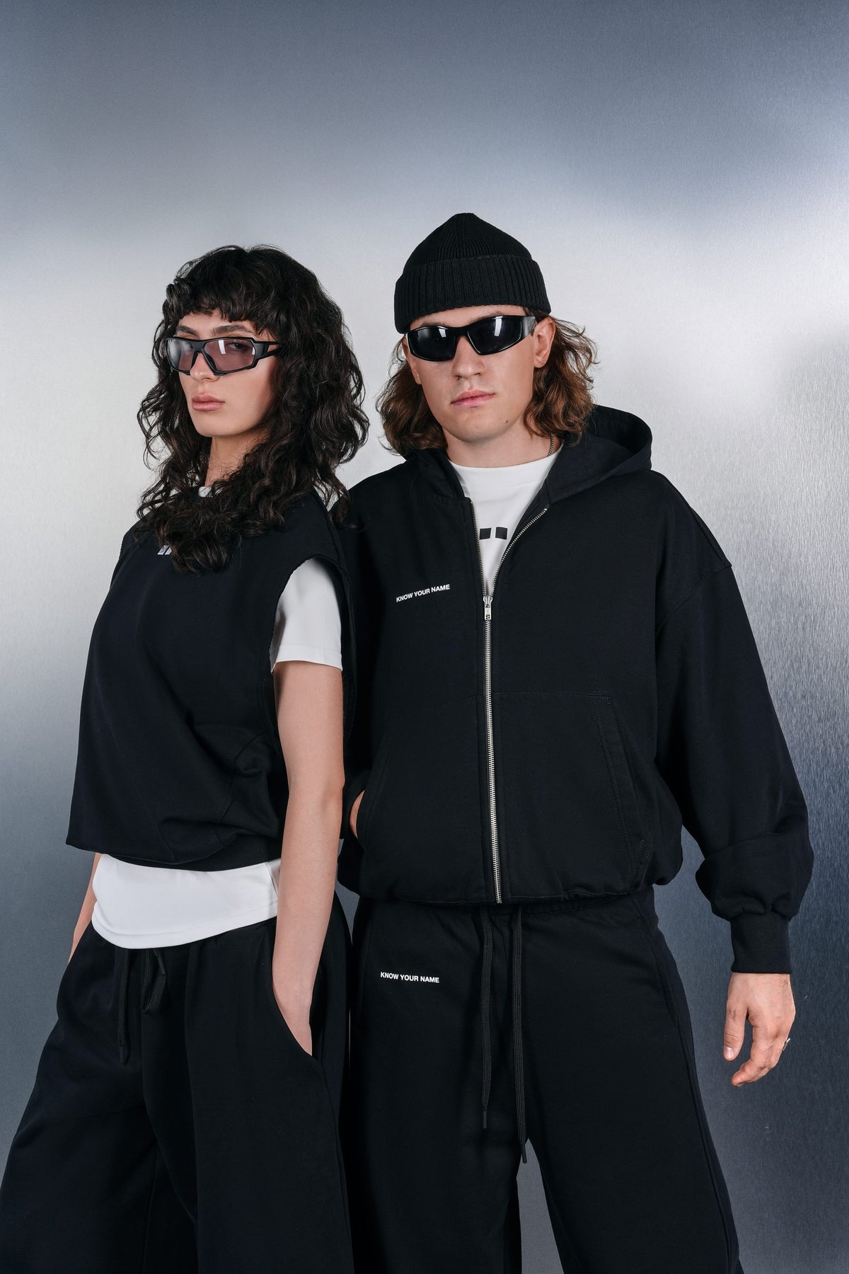 Black vest and black KYN hoodie, closer view