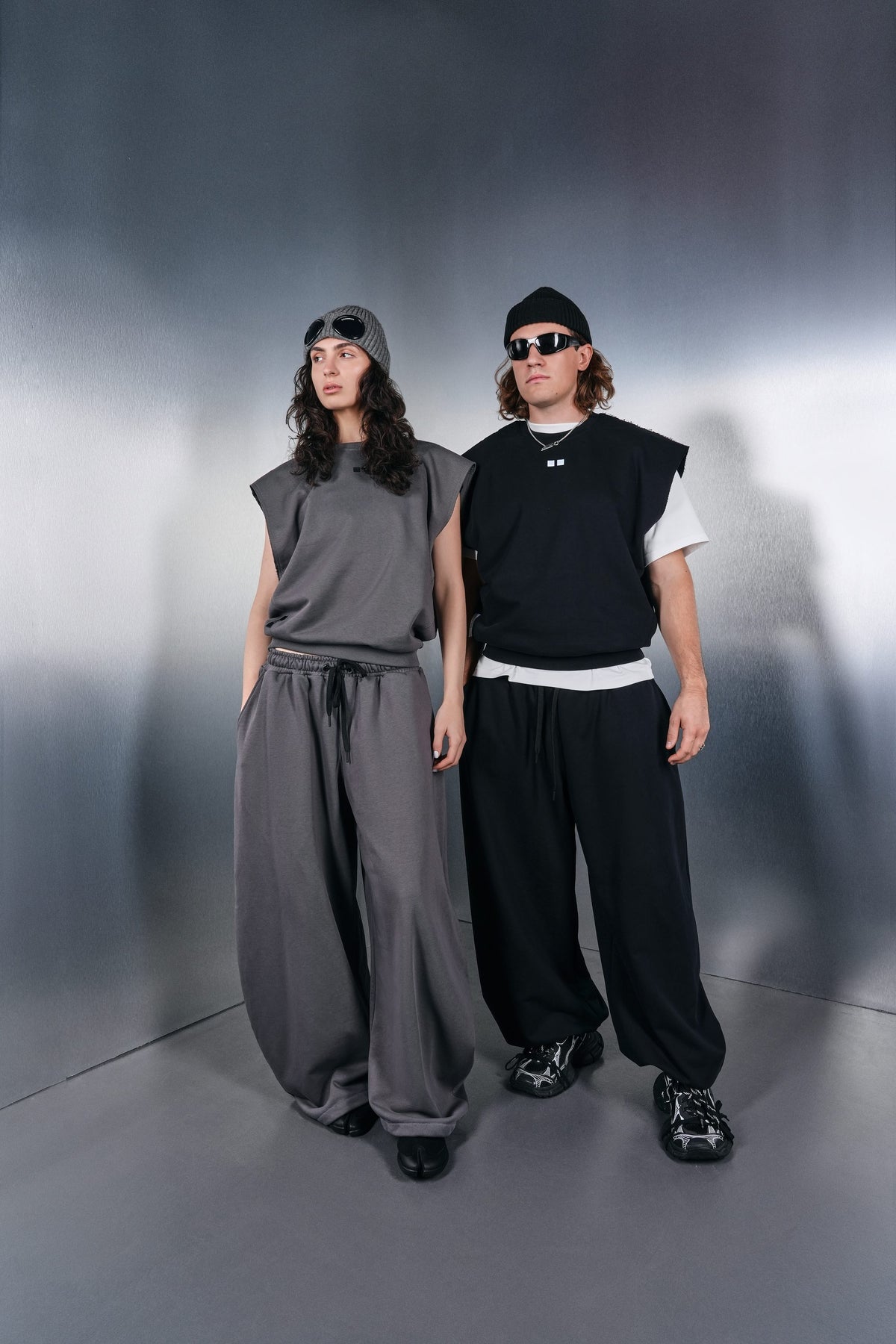 Grey and black KYN vests, grey and black trousers